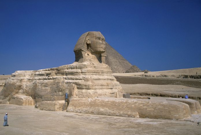Cheops Statue located at the front view of the Egyptian Pyramid in Giza, Cairo.